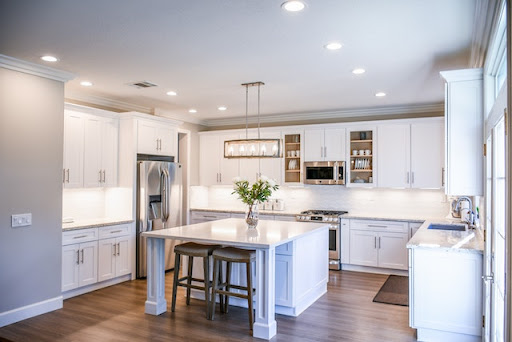 White painted cabinets in a large modern styled kitchen