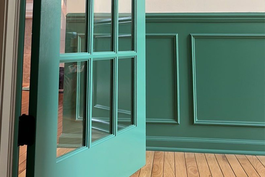 Sophisticated interior door and wall panels painted in forest green by ONiT Painting, showcasing expert interior painting services in Indianapolis.